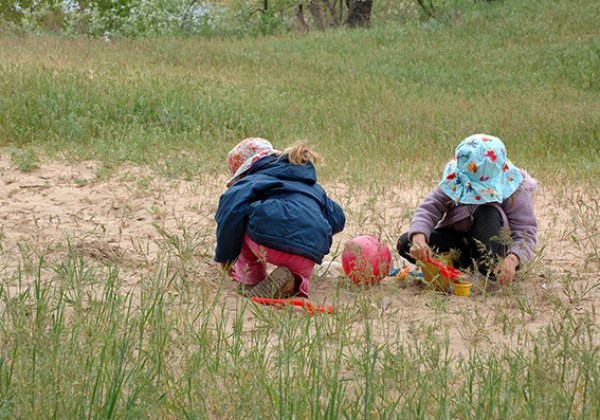 Two children playing outdoors.