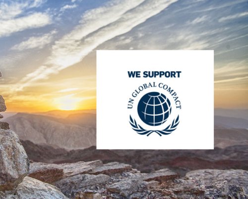 Mountains illustrating sustainability and the United Nations Global Compact logo