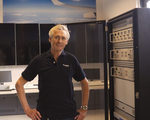 Christian Pindsle, International Sales Director for ATC & Coastal, Jotron in front of a ATC radio rack.
