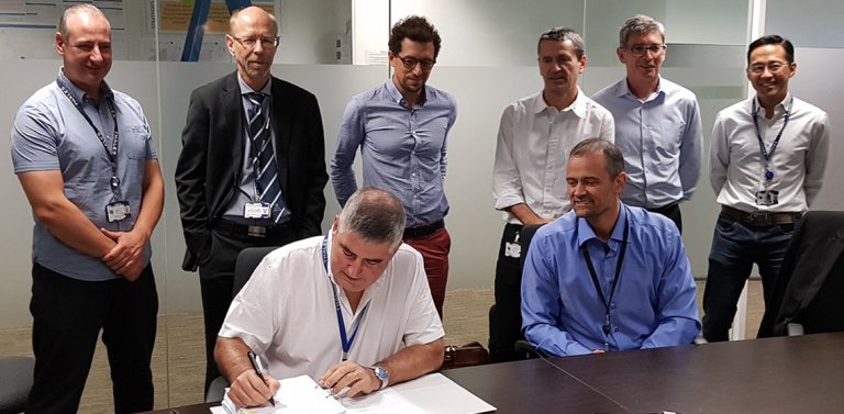 Representatives for Australia's OneSky and Jotron sign contract for Ricochet recording system.