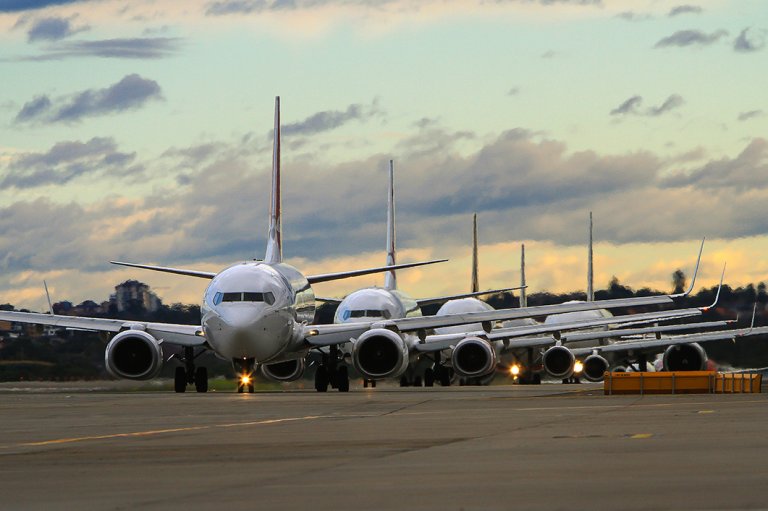 Aircrafts at a busy airport.