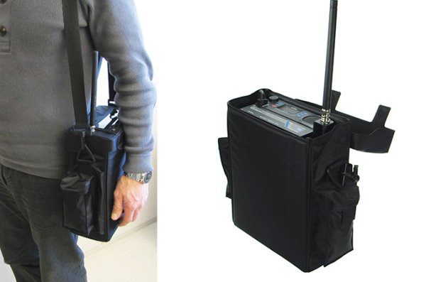 A man carrying a TR-810 MP Transceiver Man Portable version in a carrying bag.
