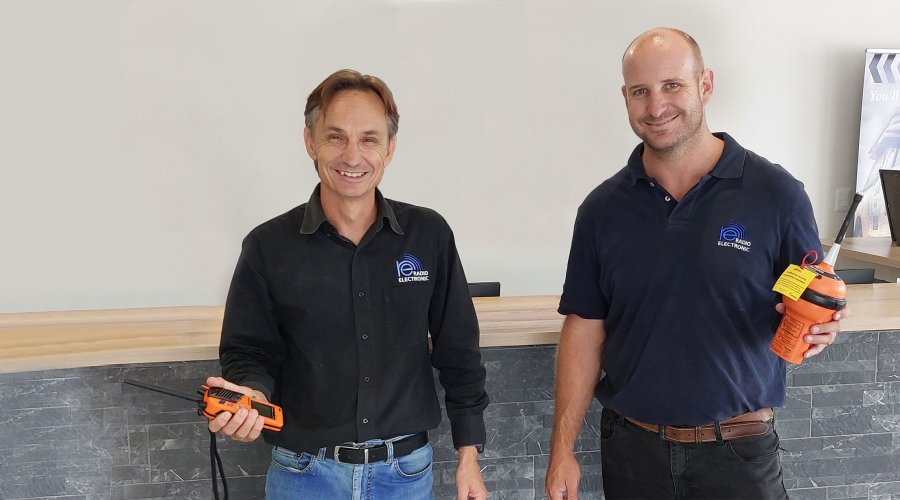 Francois du Toit from Radio Electronic Namibia holding EPIRBs.