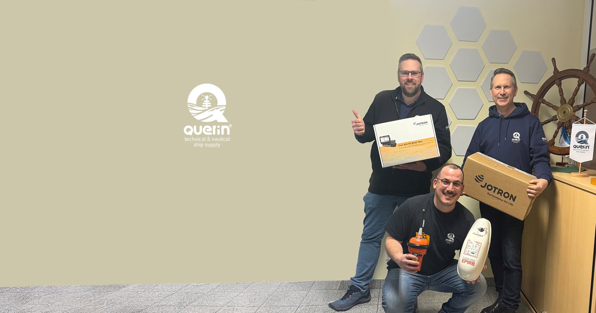 Three employees from Querin GmbH holding Jotron products. Three employees from Querin GmbH holding Jotron products.