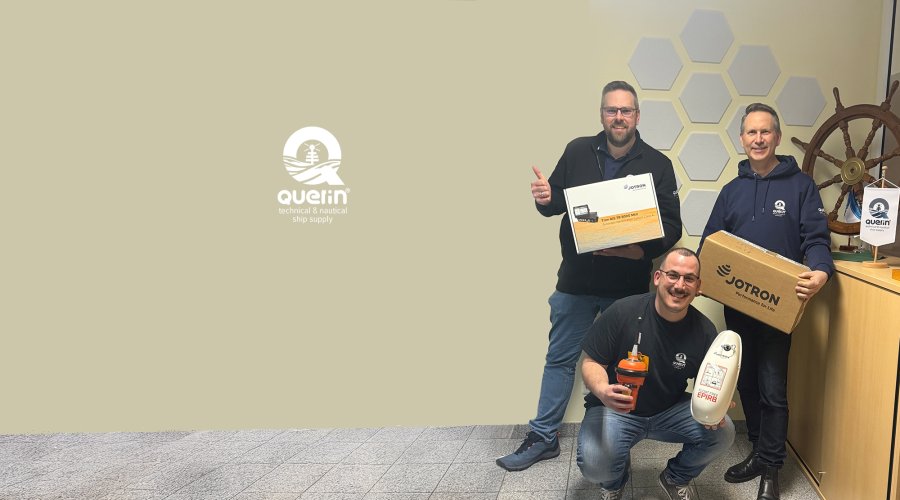 Three employees from Querin GmbH holding Jotron products.